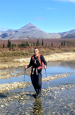Mike Wentraub standing in water in Alaska in summer of 2018.