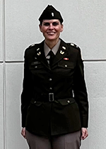 Jennifer Reed standing outside the U.S. Army's "The Judge Advocate General's Legal Center and School"